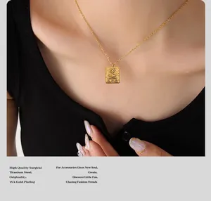 Detail of 18K gold plated titanium pendant with Egyptian sun relief and zircon inlay