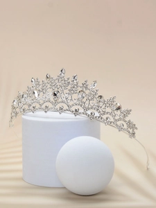 Detail of silver bridal crown with sparkling rhinestones on a minimalist white base