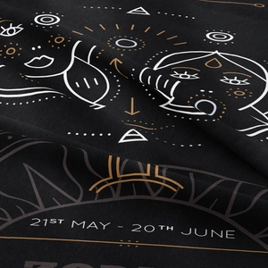 Detail of Gemini zodiac tapestry fabric with 21st May to 20th June print