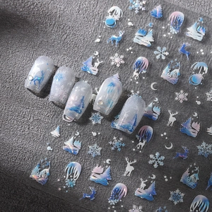 Christmas nail art stickers featuring laser reindeer and snowflake designs on grey texture