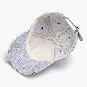 Vintage washed denim baseball cap with distressed brim and distressed blue snowflake texture