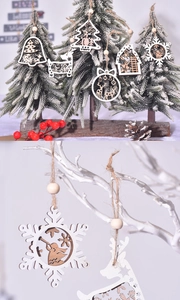 Macro shot of laser-cut wooden Christmas ornaments with reindeer and snowflake patterns
