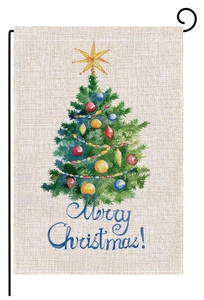 Close-up of burlap Christmas garden flag with watercolor tree and Merry Christmas text