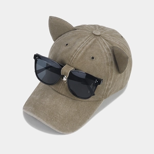 Detail of khaki cat ear baseball cap with integrated black square aviator sunglasses