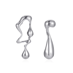 Macro detail of liquid metal style asymmetric silver earrings with a high-polished finish
