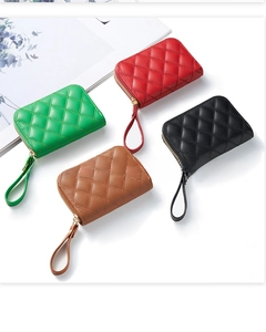 Close-up of diamond quilted accordion cardholders in four colors with gold zipper hardware