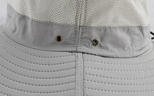 Detail of light gray outdoor sun hat showing breathable mesh and adjustable drawstring