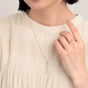 Detail of 925 sterling silver gold-plated ring and necklace with natural prehnite stones