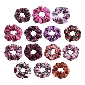 Set of 15 large scrunchies with floral and skull patterns in various colors
