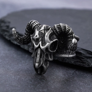 Detailed macro view of vintage gothic sheep skull ring with punk metallic texture