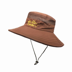 Detail of breathable mesh and travellero mountain embroidery on a brown sun hat