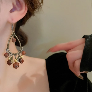 Vintage bohemian bronze teardrop earrings with beads and ethnic tassel pendants