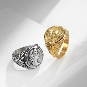 Vintage Caesar Roman coin rings in gold and silver finish on white geometric stand