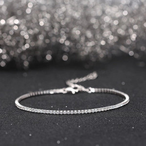 Macro detail of 1.5mm silver tennis bracelet with cubic zirconia and lobster clasp