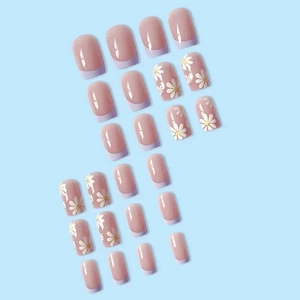 Short French press-on nails with daisy print and lavender tips in 24-piece set