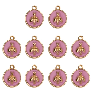 Group of ten gold-plated bee charms with pink enamel details for DIY jewelry making
