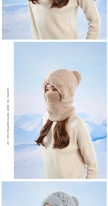 Detail of winter warm knit hood with faux fur lining and cute pompom on top