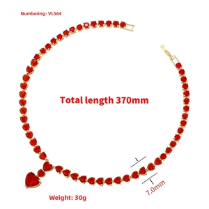 Macro detail of gold plated necklace with red heart zircons and 370mm length measurement