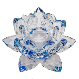 Exquisite crystal lotus flower ornament with blue petal tips on a clean white background