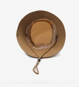 Detail view of khaki sun hat with breathable mesh lining and adjustable chin strap