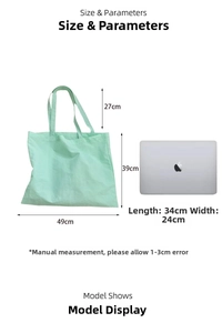 Bolso tote de lona verde menta grande 49x39cm mostrado junto a un portátil para escala