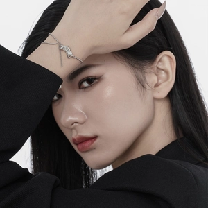 Minimalist S925 sterling silver pearl bracelet on female model in sleek black suit