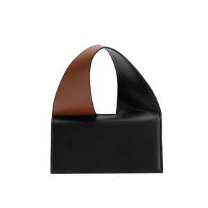 Minimalist colorblock leather handbag in black and brown with wide shoulder strap