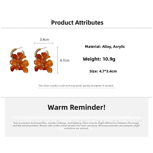 Détails des boucles d'oreilles fleurs orange en acrylique avec taille 4,7x3,4cm et poids 10,9g