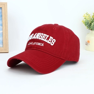 Classic deep red baseball cap with white Los Angeles embroidery in a lifestyle setting