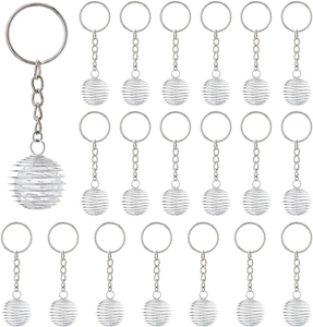 Detailed macro view of silver spiral cage pendant charms with hanging chain set