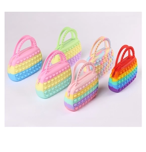 Detailed view of unicorn and heart shaped silicone bubble handbags in various candy colors