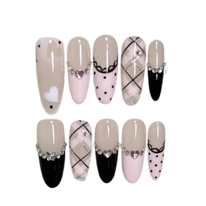 Pink and black press-on nails set with heart rhinestones, lace patterns and plaid designs