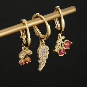 Golden hoop earring set with cherry and angel wing pendants and zircon stones