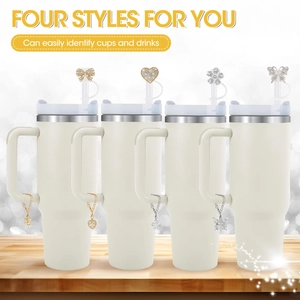 Four white tumblers with handles featuring rhinestone bow heart and flower charms