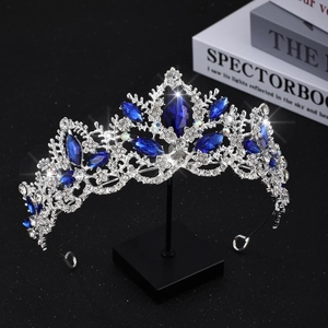 Detail of silver bridal crown with deep blue teardrop stones and sparkling crystals