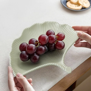 Light green ginkgo leaf ceramic tray with detailed veins and stem handle for home decor