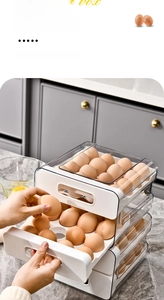 Close-up of a clear drawer-style egg storage box with multi-layer collision protection