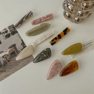 10-piece set of acetate hair clips featuring leopard print and marble patterns for women