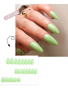 Detail view of almond mint green press-on nails set with 24 pieces in glossy finish
