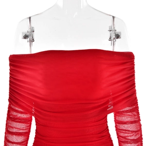 Close-up of red off-shoulder bodycon dress with ruching detail on soft mesh fabric