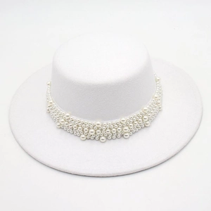 Detailed top view of white wool felt boater hat featuring multi-layered pearl trim decor
