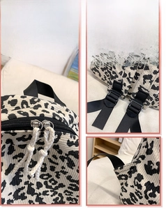 Detail view of corduroy leopard backpack with dual zippers and adjustable straps