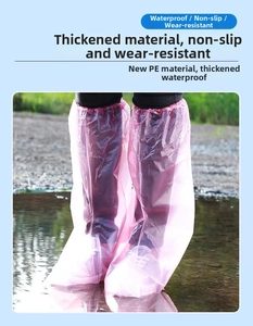 Close-up of pink thickened PE waterproof shoe covers shown in outdoor water puddles