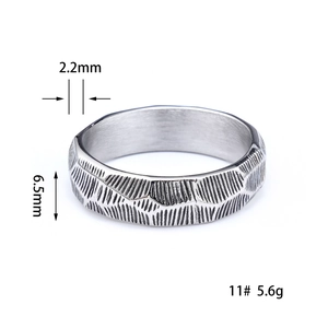 Detail view of 6.5mm wide Celtic knot steel ring showing dimensions and texture