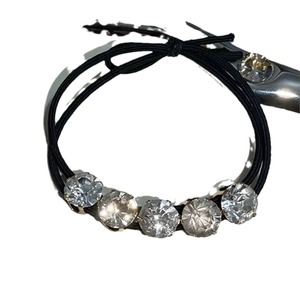 Black high-elastic hair tie with five sparkling round rhinestones in a minimalist style