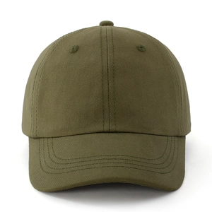 Close-up of olive green cotton twill baseball cap showing stitching and fabric texture
