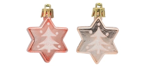 Detailed view of star-shaped Christmas ornaments with glitter tree patterns in pink and gold