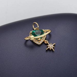 Macro shot of gold-plated heart gemstone pendant with star charm and zircon details