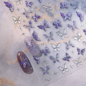 Autocollants à ongles papillon pailletés bleu et violet avec contours argentés et étoiles