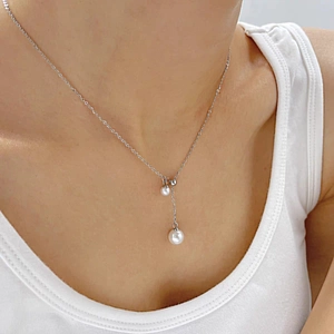 French style pearl titanium steel necklace with double pendant on model neck
